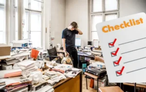 Cleaner organizing messy office full of papers