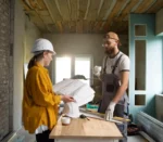 two workers working on renovation of apartment